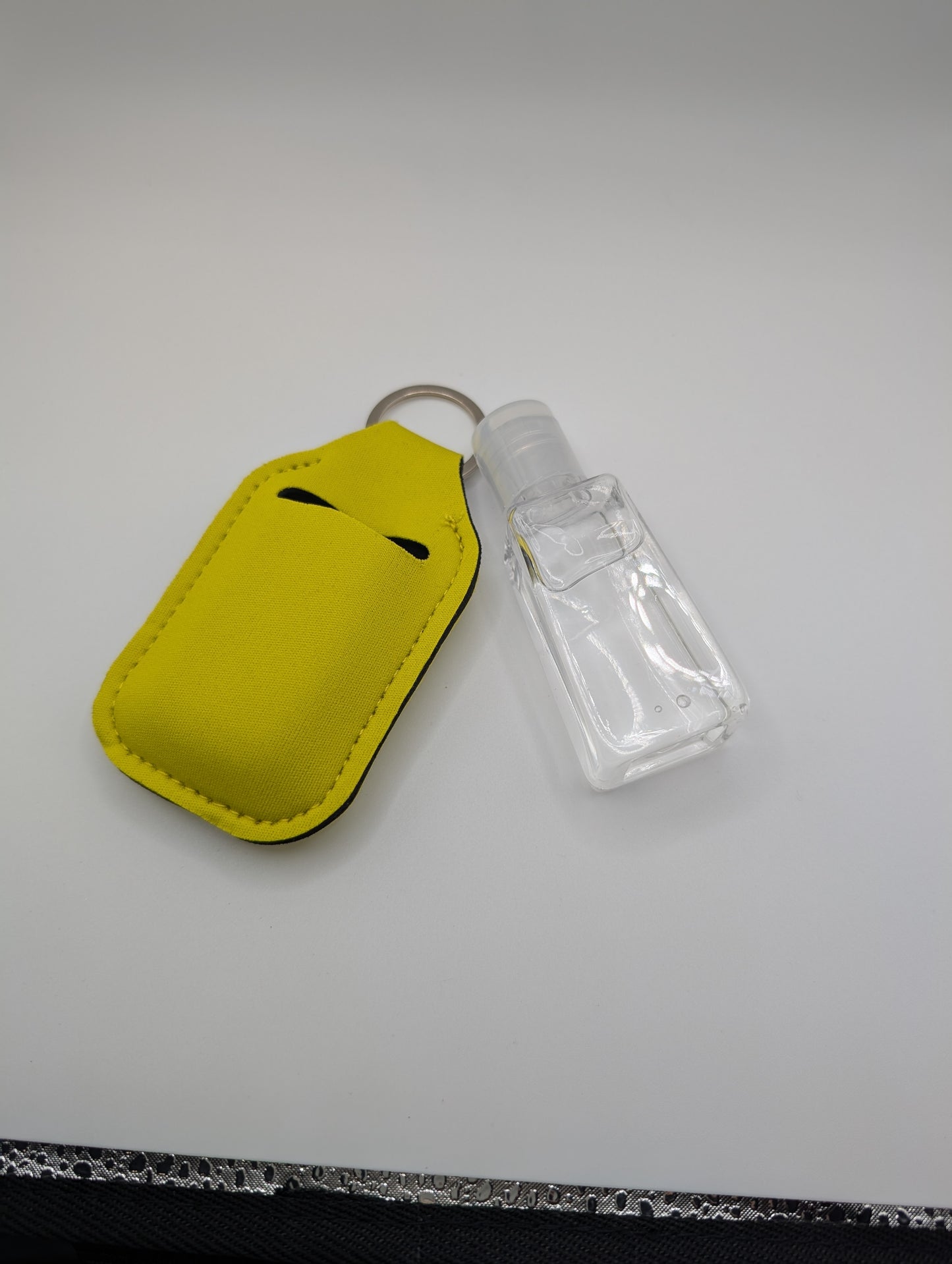 Hand sanitizer with keychain holder