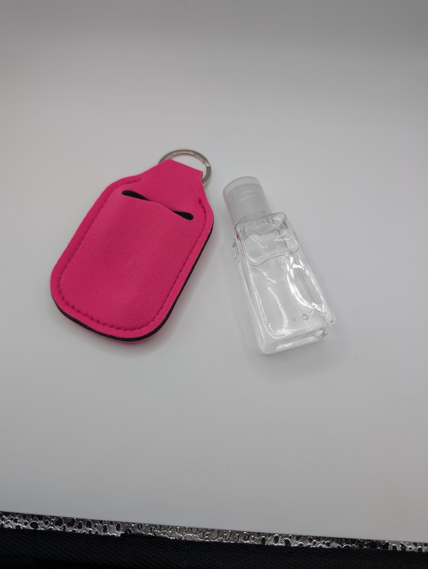 Hand sanitizer with keychain holder