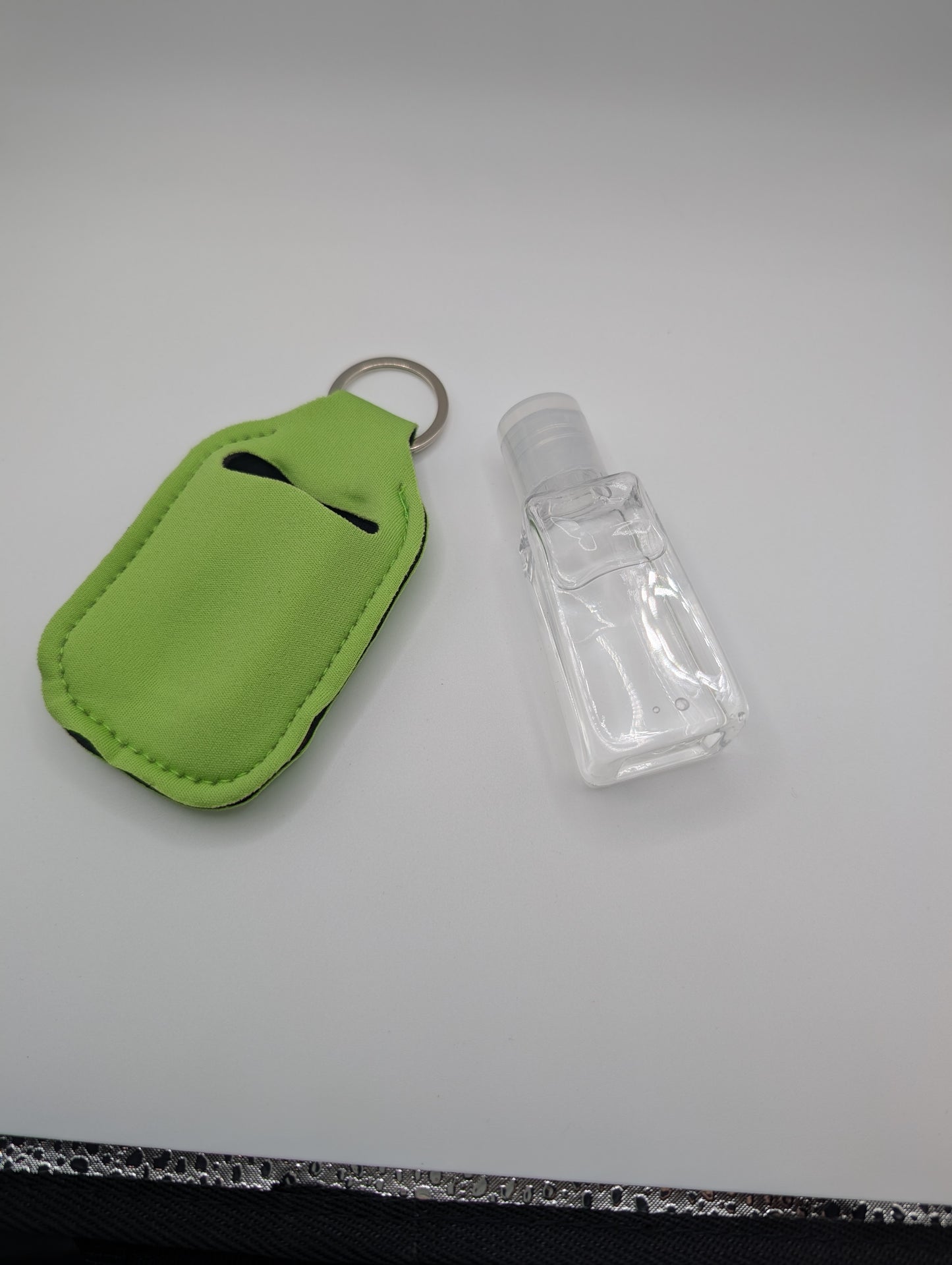 Hand sanitizer with keychain holder