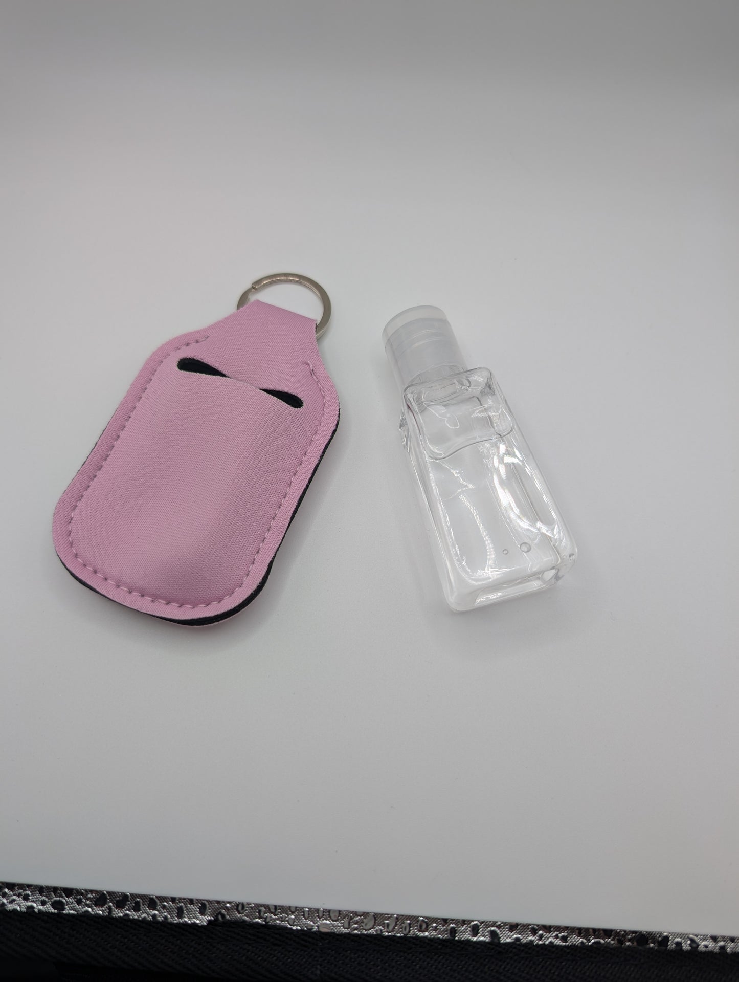 Hand sanitizer with keychain holder