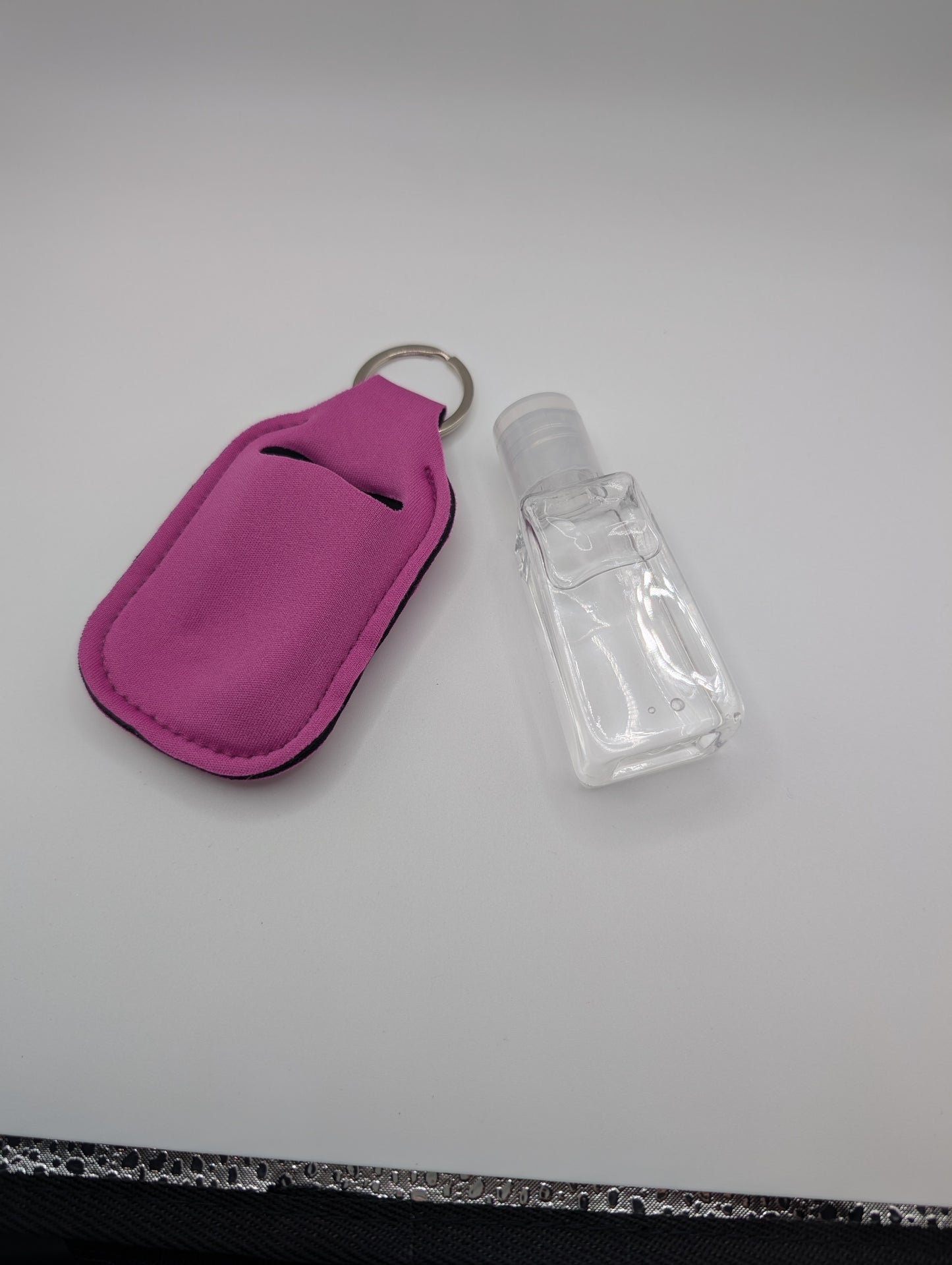 Hand sanitizer with keychain holder