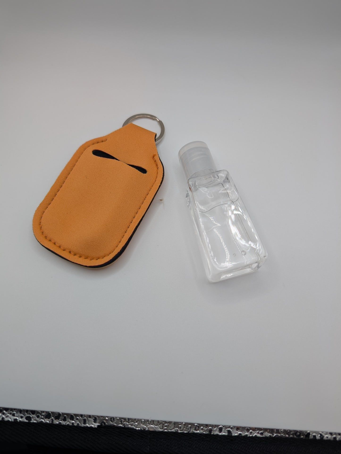 Hand sanitizer with keychain holder