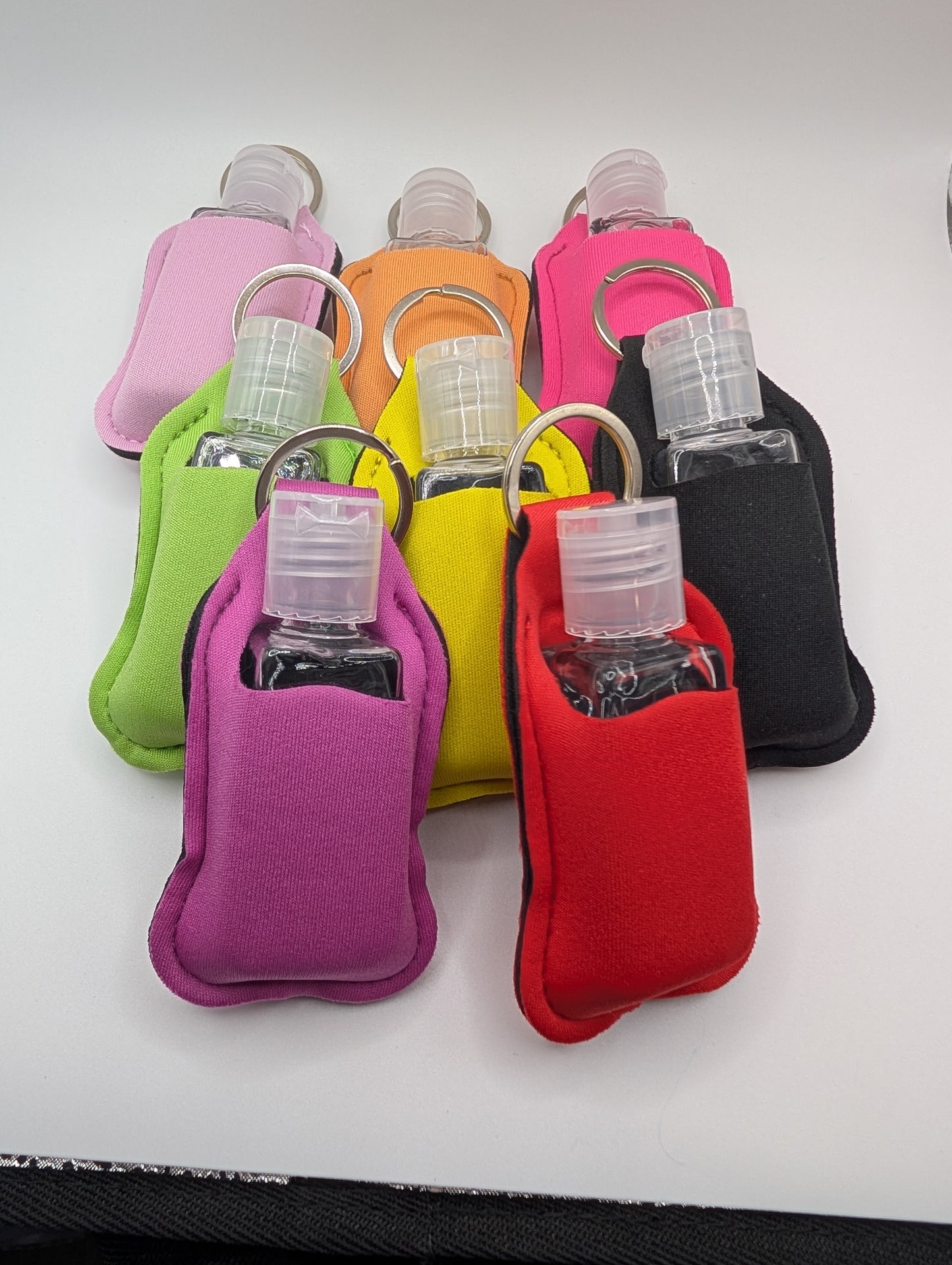 Hand sanitizer with keychain holder