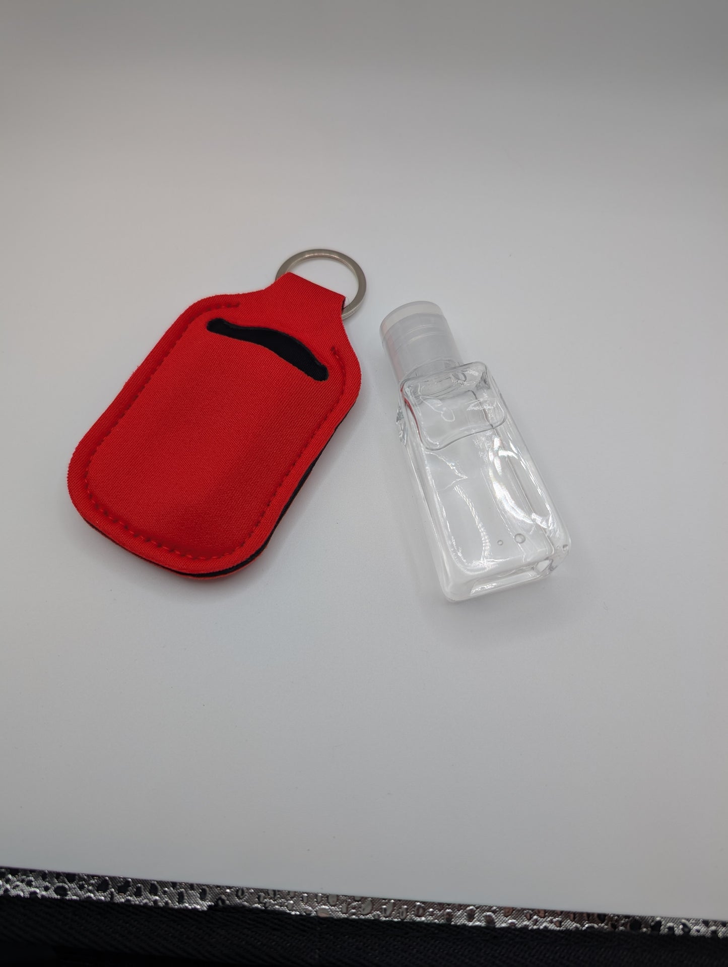 Hand sanitizer with keychain holder