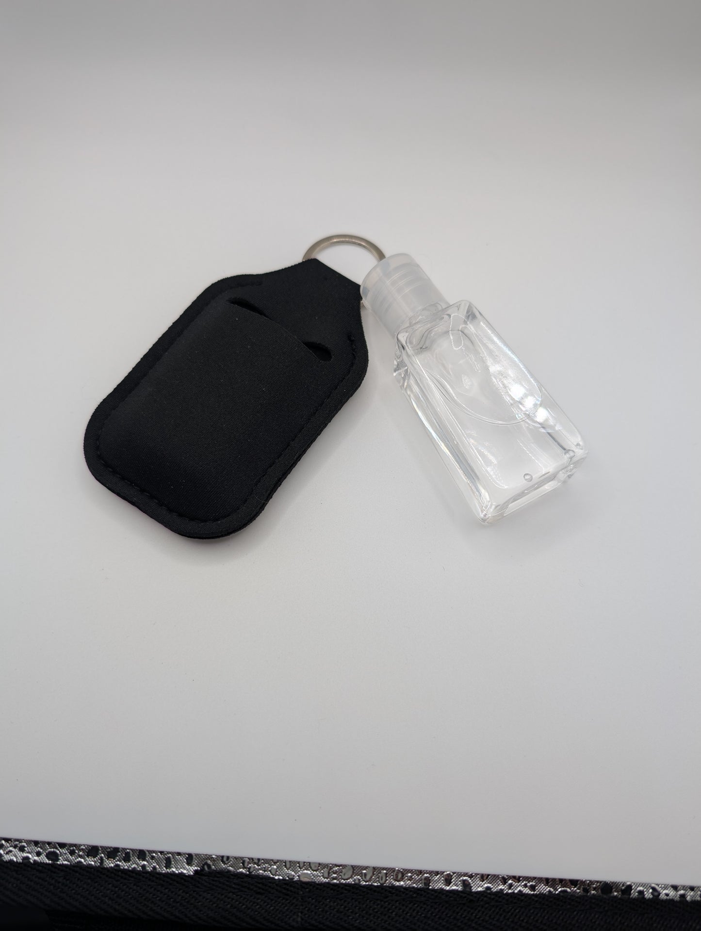 Hand sanitizer with keychain holder